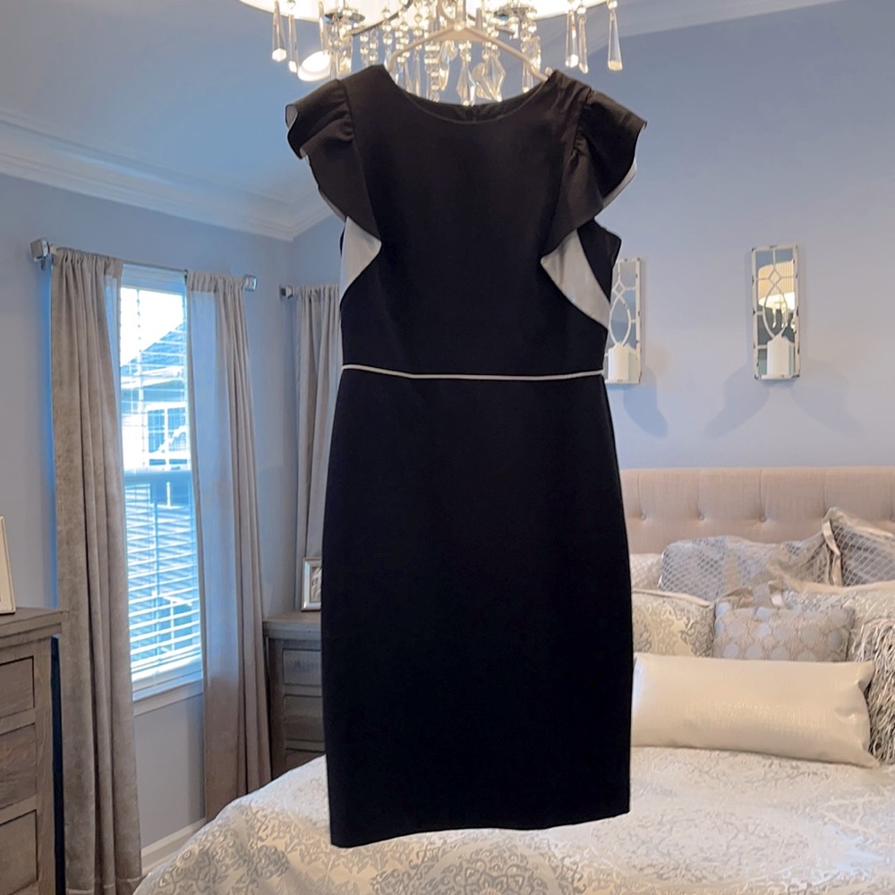 Black dress with white satin trim and details